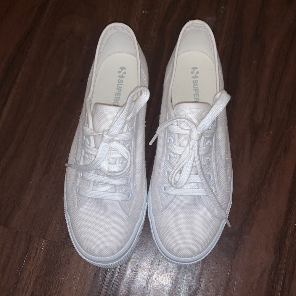 All white Superga sneakers